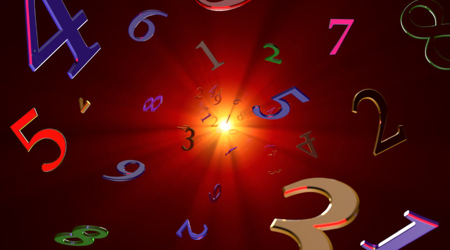 numbers floating on dark background with sunburst in the center